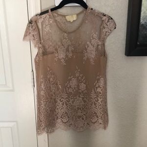 Elegant semi-sheer cream lace shirt. Women’s x-small will fit women’s small